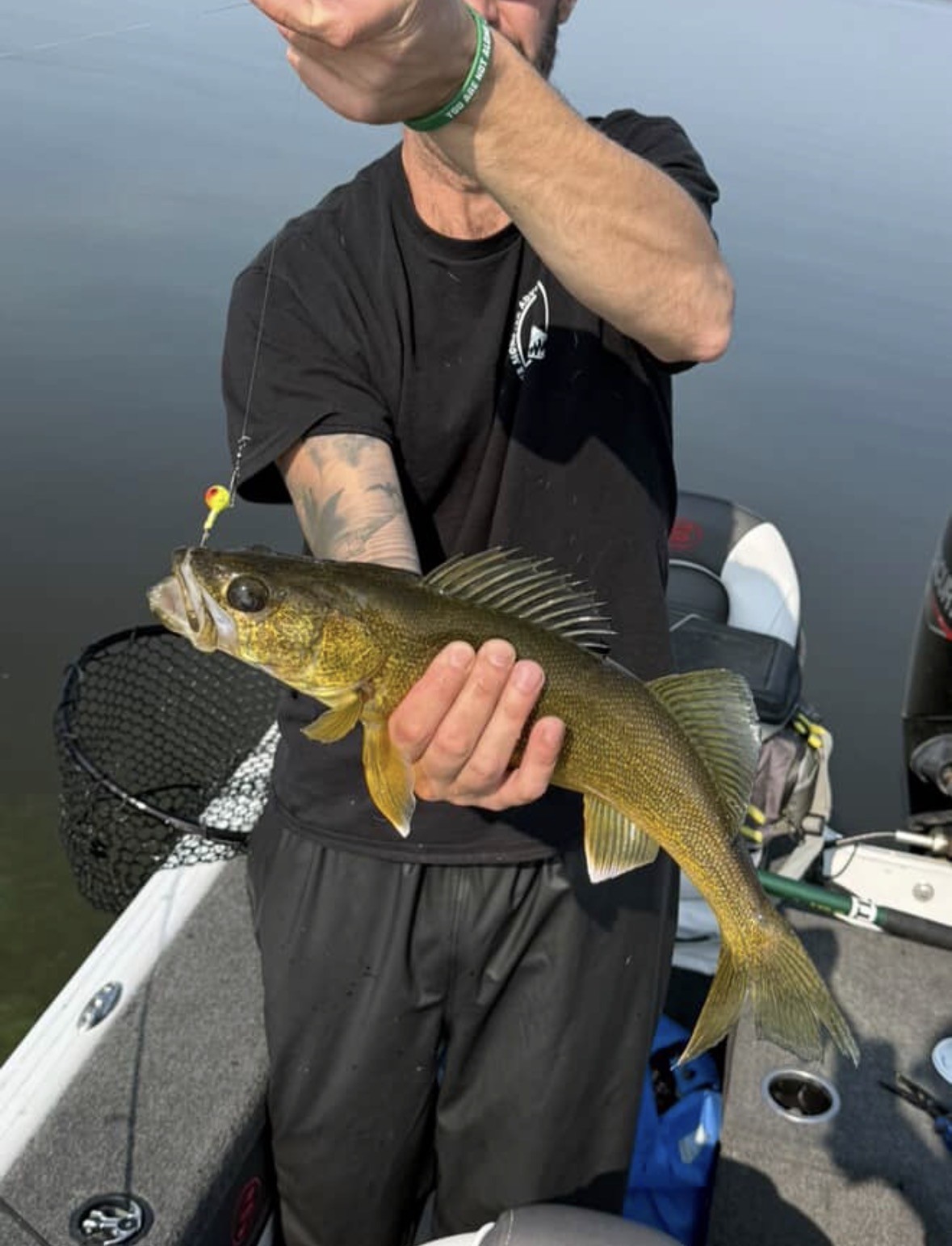 Angler with a walleye caught on a French's jig