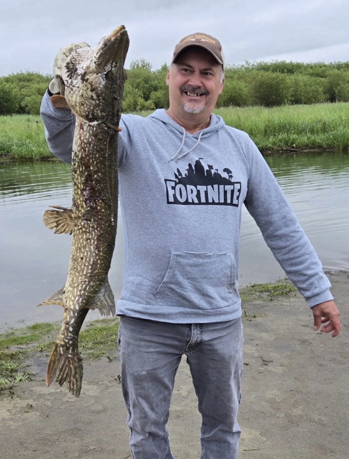 Angler with a trophy northern pike